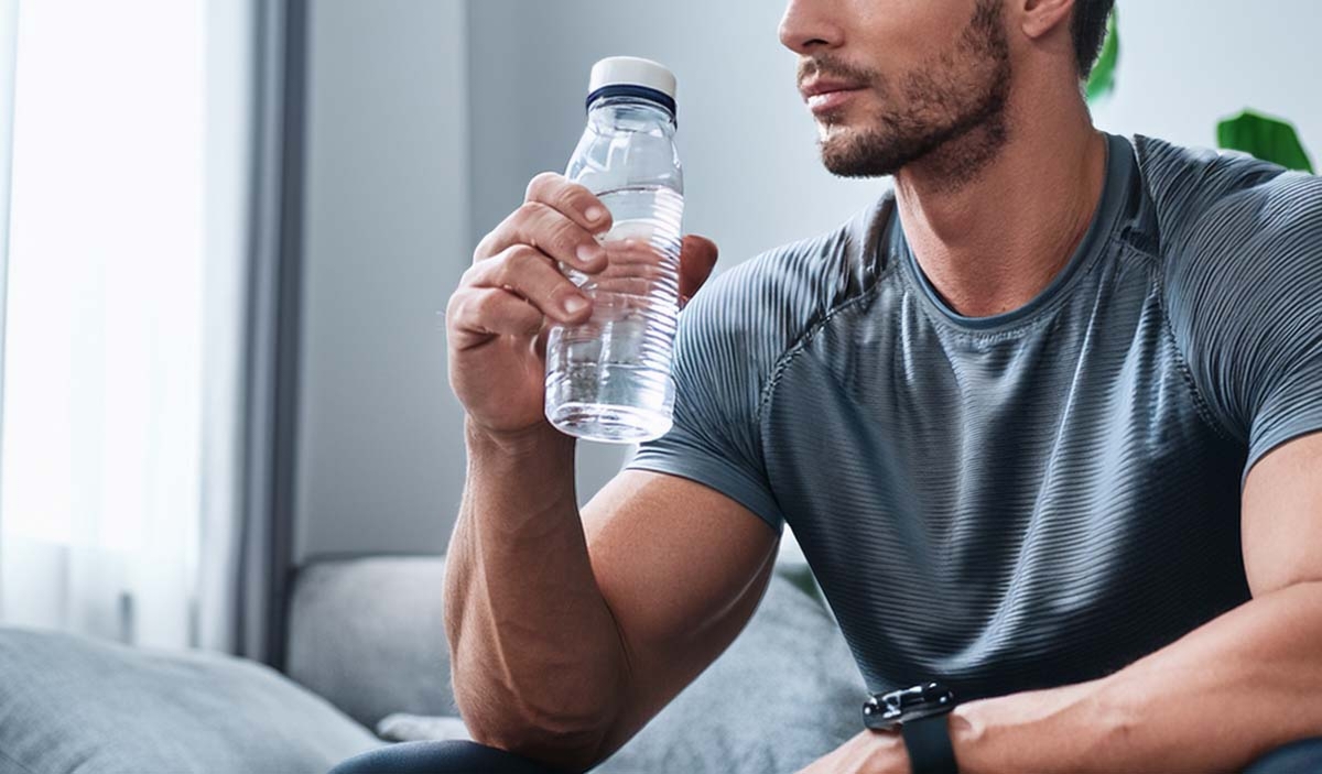 Man Resting And Hydrating During Cleaning Break