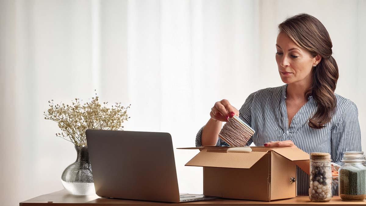 Woman Organizing Items On Desk