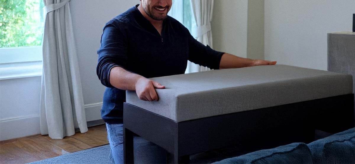 Man Lifting The Lid Of Ottoman